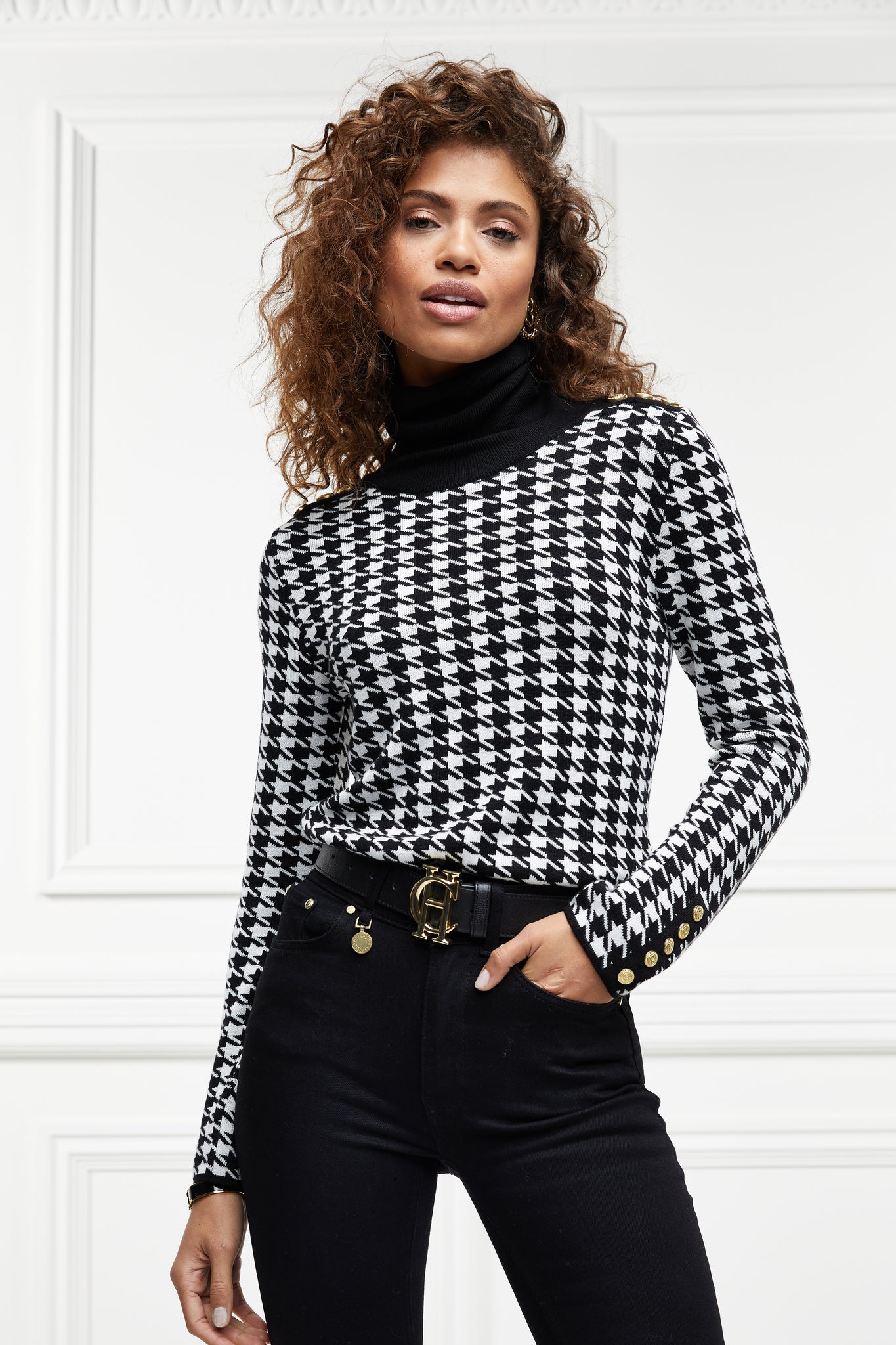 a classic black and white houndstooth jumper with contrast black roll neck collar