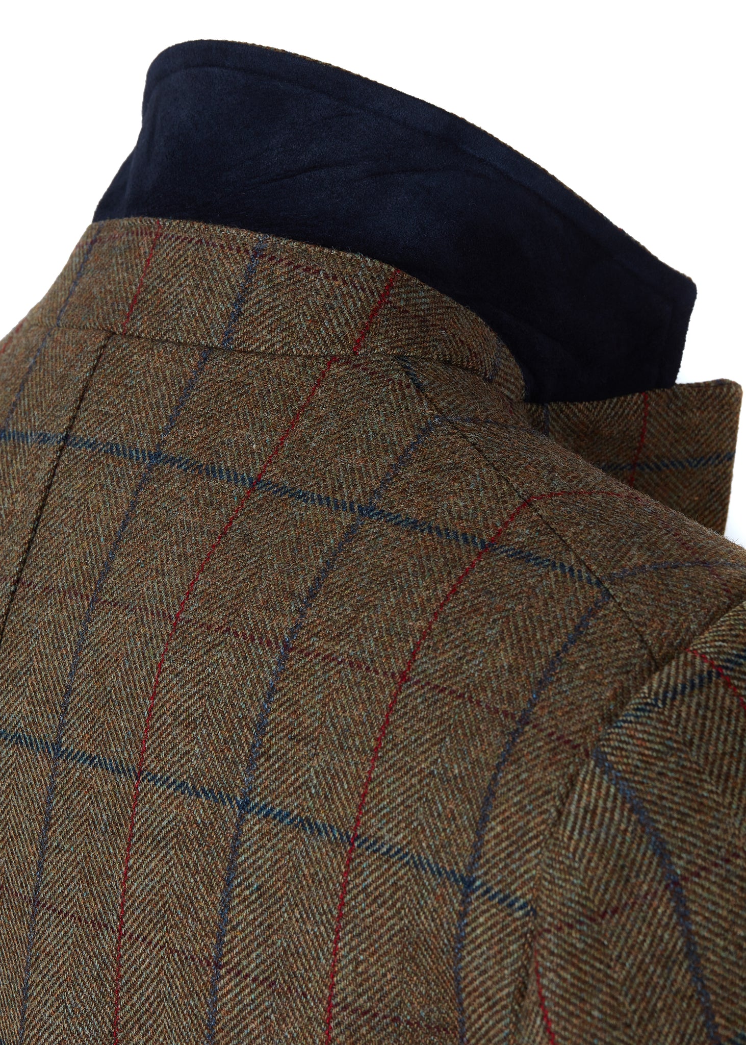 Green tweed mens coat with collar popped to show navy under collar