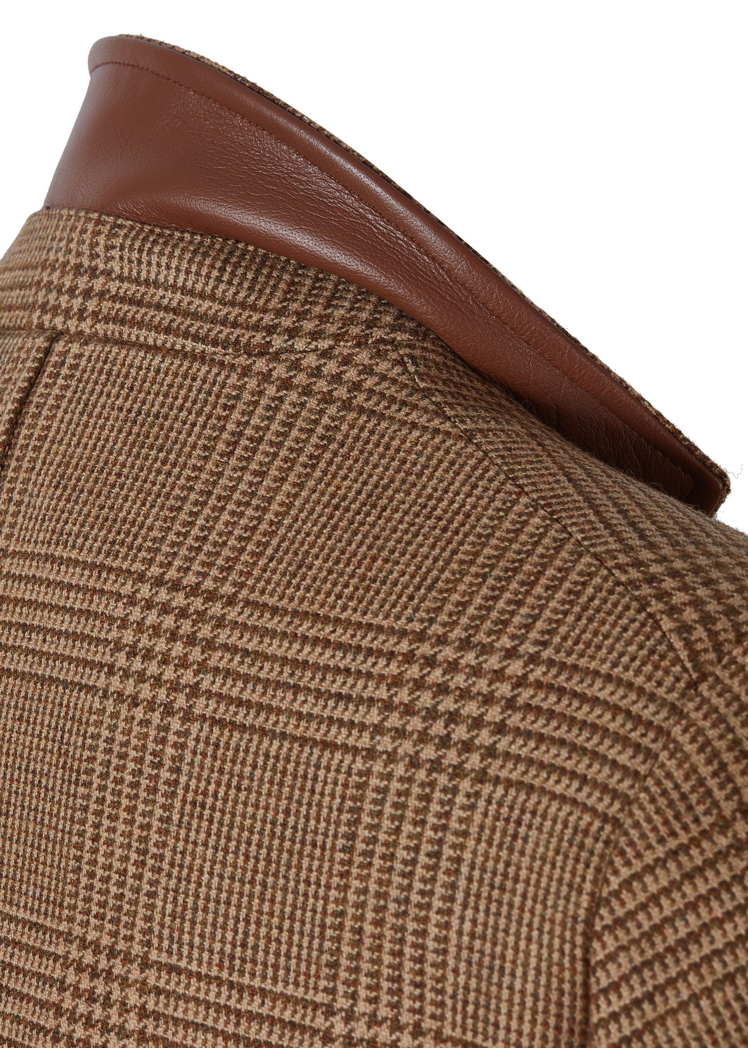 Tawny brown tweed mens coat with collar popped to show brown leather under collar